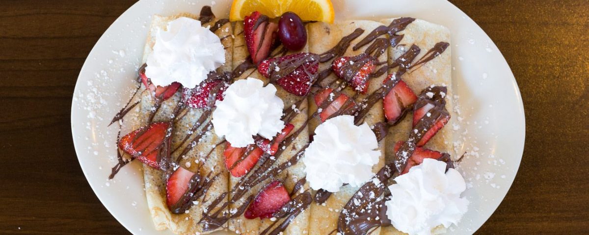 crepes with whip cream and strawberries the pancakery